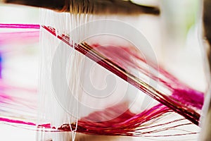 Close up of Thai Silk weaving on a traditional loom