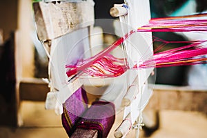 Close up of Thai Silk weaving on a traditional loom