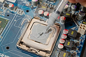 Close-up Thermal compound on cpu chip in mainboard computer