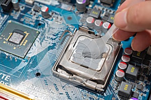 Close-up Thermal compound on cpu chip in mainboard computer