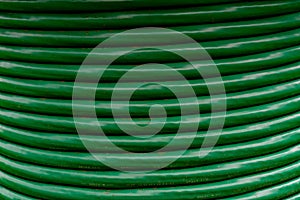 Thick green cable in a coil
