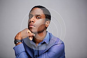 Close up thinking african american man with hand on chin