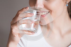 Close up of thirsty woman enjoying pure water