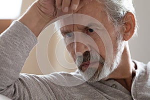 Close up thoughtful frustrated mature man thinking about problems