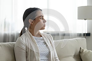 Close up thoughtful upset young woman thinking about problems photo