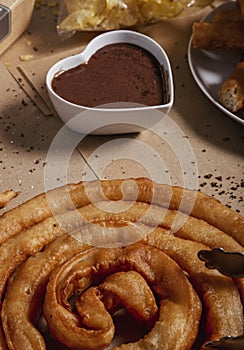 Close-up of the thread of batons with a cup of chocolate. Typical Spanish product