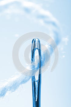 Close-up thread a needle