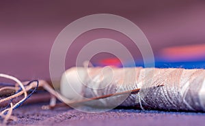Close up of a thread and a needle