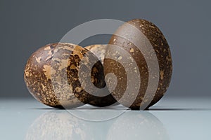 Close-up of three funny colored brown Easter eggs