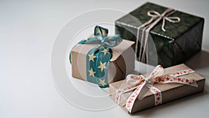 Close-up of three gift boxes with beautiful bows of ribbons with a pattern of stars on a white background,copy space.Festive gift