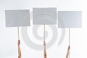 Close up of three protest signs