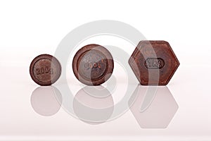 Vintage things. Old style metric weights isolated on white background.