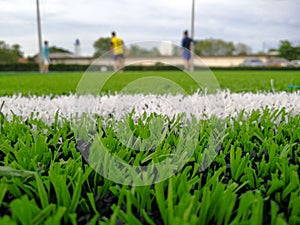 Close up of throw in, kick off and corner area. Lushed green football pitch