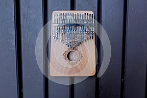 Close up of a thumb piano or kalimba on a wooden table