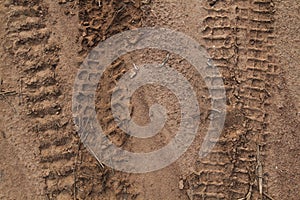 Close up of tire tracks in the sand