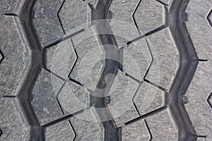 Close-up, tire tread wear of the surface through the use of a car.