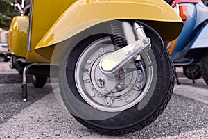 close up of the tire of a vintage italian scooter, symbol of Italian design