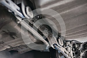 Close up tire wheel bush-bolt under double wishbone suspension car lift