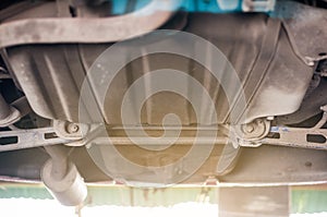 Close up tire wheel bush-bolt under double wishbone suspension car lift