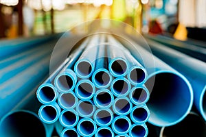 Close up to blue plastic pipe background, PVC pipes stacked in warehouse