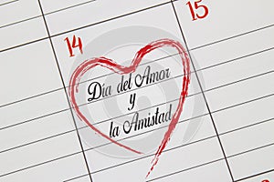 A close up to a Calendar on Feb 14 with the text on Spanish: `DÃ­a del Amor y la Amistad` in English Day Of Love And Friendsh