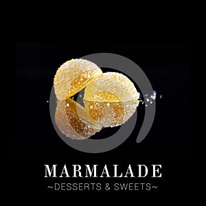 Close up to jelly marmalade dessert isolated on black background. Colourful sweets with reflection and citrus flavour. Ready menu