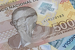 Close up to 500 Kwanza of the Republic of Angola. Polymer banknotes of the African country. Detailed capture of the portrait of