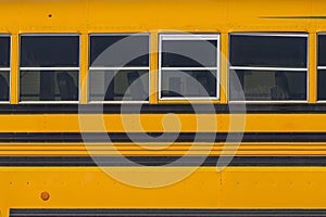 A close up to a school yellow bus.