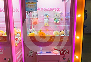 Close up to toys machine at shopping mall. Arcade claw machine toys crane game