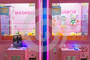 Close up to toys machine at shopping mall. Arcade claw machine toys crane game