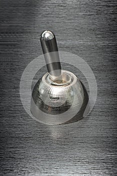 Close up of toggle switch on brushed metal switch photo