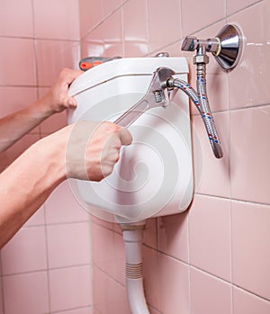 Close-up of toilet reparation