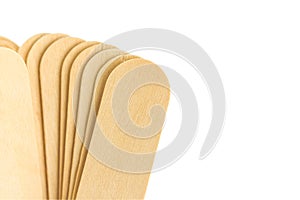 Close up of tongue depressor on white background