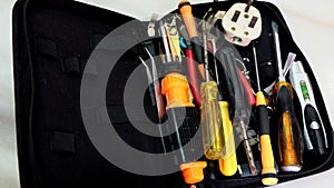 Close up of a tool bag with unsorted tools