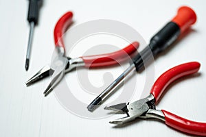 Close up of tools for repair electronics and other precision work on the white background