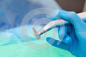 Close-up of a tooth drill with a head for polishing and brushing teeth. Professional oral hygiene