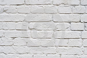 Close up top above front detailed view photo of old with scratches white brick wall. Old white brick wall texture background. Mode