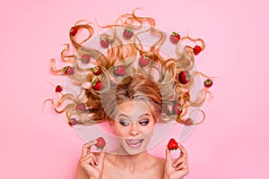 Close up top above high angle view photo beautiful she her lady lying down among fruit strawberries long hair pick two