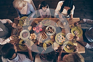 Close up top above high angle view photo people family thanksgiving conversation members company brother sister granny