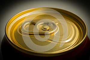 Close-up of the top of aluminum can for soft drinks or beer with still closed cap. side shot