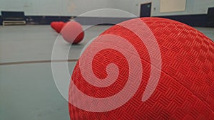 Close up of the top of dodgeballs lined up photo