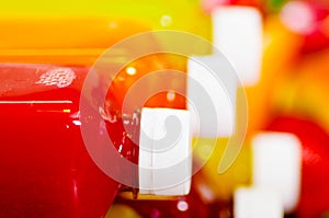 Close up top of juice bottles lying down stacked, beautiful colors and healthy concept