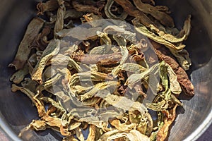 Close-up top shoot of string beans dried under the sunlight on the cook pot