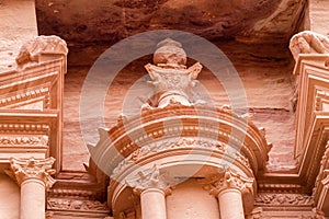 Close-up of the top of urn of Al-Khazneh in Petra Jordan. photo