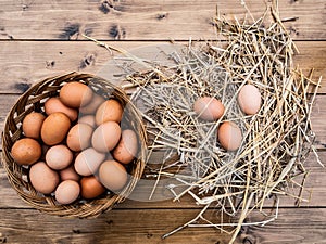 Close up top view of a basket of fresh Italian eggs with hay