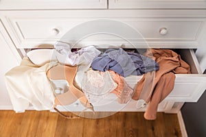 close-up, top view of a closet shelf, with women& x27;s underwear, bra, undershirt and panties