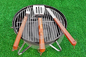 Close-up Top View Of Grill Tolls On The BBQ Appliance