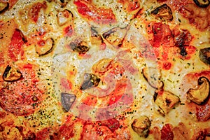 Close-up, top view of mushroom pepperoni artisan pizza, Italian food
