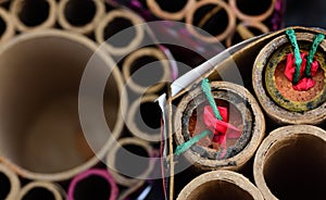 Close-up and top view of partially burned-down fireworks that are left after the Sylvester night or party, with duds in a photo