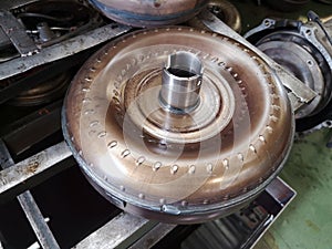 Close-up torque converter.  it in an automatic transmission of a supported car in an auto repair shop